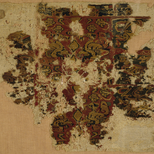 image for: Anònim - Fragment de teixit copte amb flora, animals fantàstics i un bust - Egipte, segle IX
